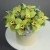 Композиция в шляпной коробке из 11 лаймовых орхидей в Ногинске